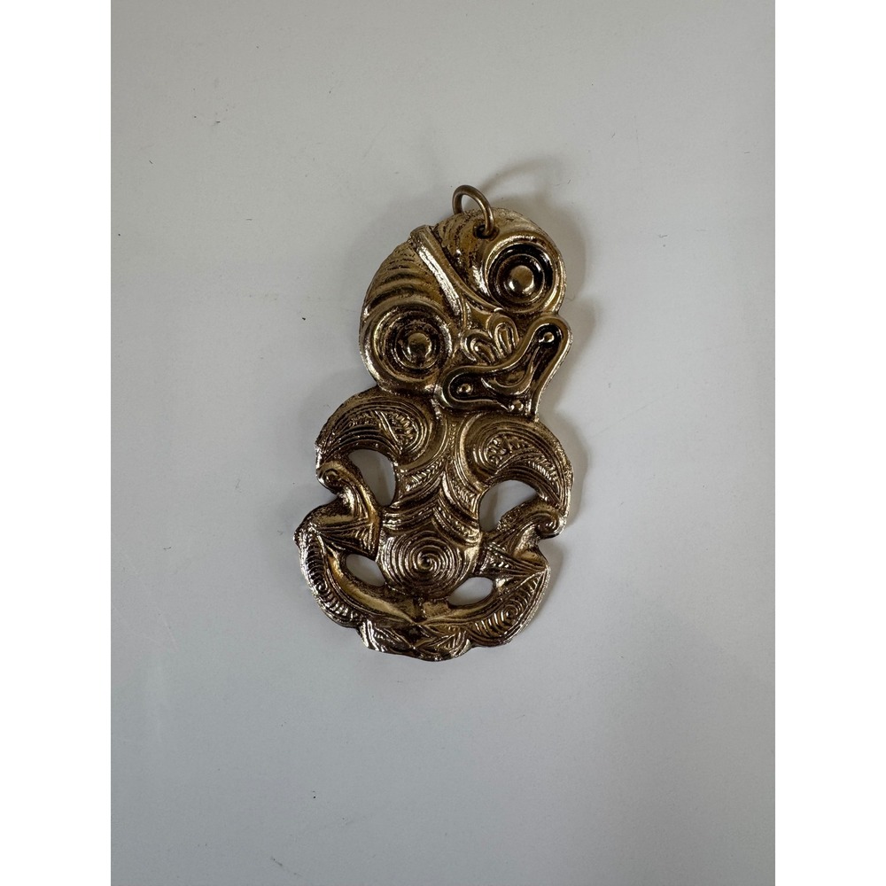 Vintage New Zealand Maori Hei Tiki Pendant Gold Tone Metal Souvenir 3.25 Inch